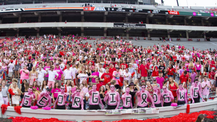 Georgia Bulldog fans are seen painted in pink in honor of Head Coach Blake Anderson's wife Wendy Anderson recently losing her battle with cancer (Photo by Carmen Mandato/Getty Images)