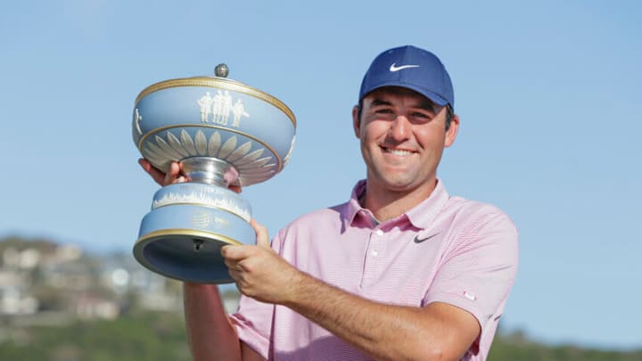 Mar 27, 2022; Austin, Texas, USA; Scottie Scheffler holds the Walter Hagen Cup after defeating Kevin Kisner (not pictured) in the final round of the World Golf Championships-Dell Technologies Match Play golf tournament. Mandatory Credit: Erich Schlegel-USA TODAY Sports