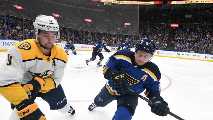 ST. LOUIS, MO – DECEMBER 27: Nashville Predators leftwing Filip Forsburg (9) and St. Louis Blues right wing Vladimir Tarasenko (91) go after a loose puck on the boards in the first period during a NHL game between the Nashville Predators and the St. Louis Blues on December 27, 2017, at Scottrade Center, St. Louis, MO. Nashville won, 2-1. (Photo by Keith Gillett/Icon Sportswire via Getty Images)