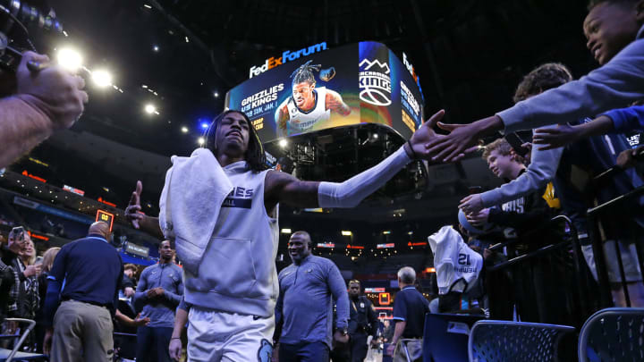 Memphis Grizzlies guard Ja Morant shakes hands with a fan. Mandatory Credit: Petre Thomas-USA TODAY Sports