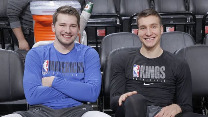 SACRAMENTO, CA - JANUARY 15: Luka Doncic #77 of the Dallas Mavericks poses for a photo with Bogdan Bogdanovic #8 of the Sacramento Kings before the game on January 15, 2020 at Golden 1 Center in Sacramento, California. NOTE TO USER: User expressly acknowledges and agrees that, by downloading and or using this Photograph, user is consenting to the terms and conditions of the Getty Images License Agreement. Mandatory Copyright Notice: Copyright 2020 NBAE (Photo by Rocky Widner/NBAE via Getty Images)