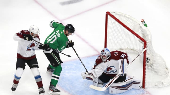 EDMONTON, ALBERTA - AUGUST 05: Corey Perry #10 of the Dallas Stars tries to get the shot past Pavel Francouz #39 of the Colorado Avalanche as Matt Nieto #83 of the Colorado Avalanche defends in the first period in a Western Conference Round Robin game during the 2020 NHL Stanley Cup Playoff at Rogers Place on August 05, 2020 in Edmonton, Alberta. (Photo by Jeff Vinnick/Getty Images)
