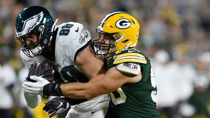 GREEN BAY, WISCONSIN – SEPTEMBER 26: Blake Martinez #50 of the Green Bay Packers tackles Dallas Goedert #88 of the Philadelphia Eagles in the third quarter at Lambeau Field on September 26, 2019 in Green Bay, Wisconsin. (Photo by Quinn Harris/Getty Images)