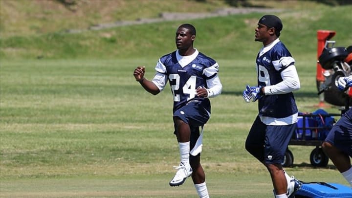 May 23, 2012; Irving, TX, USA; Dallas Cowboys cornerback Morris Claiborne (24) stretches with Brandon Carr (39) during organized team activities at Dallas Cowboys headquarters. Mandatory Credit: Matthew Emmons-USA TODAY Sports