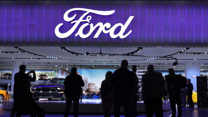 DETROIT, MI-JANUARY 15: Members of the news media stand around the entrance to the Ford Motor Company exhibit at the 2018 North American International Auto Show January 15, 2018 in Detroit, Michigan. More than 5,100 journalists from 61 countries attend the NAIAS each year. The show opens to the public January 20th and ends January 28th. (Photo by Bill Pugliano/Getty Images)