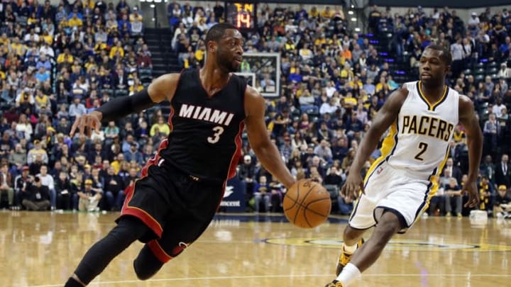 Dec 31, 2014; Indianapolis, IN, USA; Miami Heat guard Dwayne Wade (3) drives to the basket against Indiana Pacers guard Rodney Stuckey (2) at Bankers Life Fieldhouse. Mandatory Credit: Brian Spurlock-USA TODAY Sports