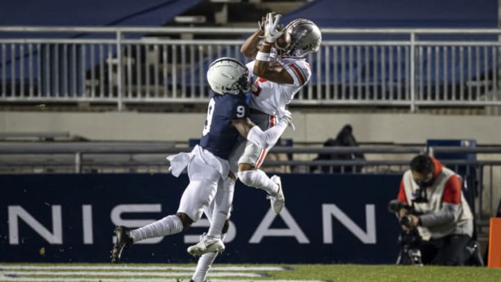 STATE COLLEGE, PA - OCTOBER 31: Chris Olave #2 of the Ohio State Buckeyes catches a pass from a touchdown while being defended by Joey Porter Jr. #9 of the Penn State Nittany Lions during the first half at Beaver Stadium on October 31, 2020 in State College, Pennsylvania. (Photo by Scott Taetsch/Getty Images)