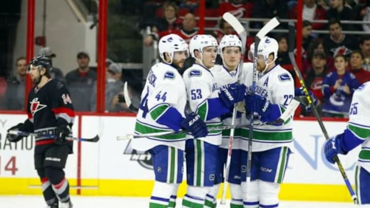 Jan 15, 2016; Raleigh, NC, USA; Vancouver Canucks forward Bo Horvat (53) is congratulated by teammates defensemen Matt Bartkowski (44) forward Jake Virtanen (18) and forward Daniel Sedin (22) after his second period goal against the Carolina Hurricanes at PNC Arena. Mandatory Credit: James Guillory-USA TODAY Sports Jan 15, 2016; Raleigh, NC, USA; Vancouver Canucks forward Bo Horvat (53) is congratulated by teammates defensemen Matt Bartkowski (44) forward Jake Virtanen (18) and forward Daniel Sedin (22) after his second period goal against the Carolina Hurricanes at PNC Arena. Mandatory Credit: James Guillory-USA TODAY Sports