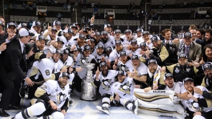 Jun 12, 2016; San Jose, CA, USA; Pittsburgh Penguins players pose for a team photo with the Stanley Cup after defeating the San Jose Sharks in game six of the 2016 Stanley Cup Final at SAP Center at San Jose. Mandatory Credit: Gary A. Vasquez-USA TODAY Sports