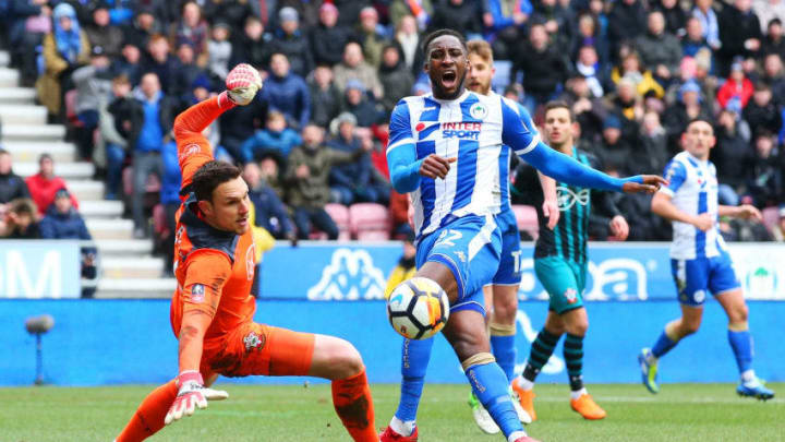 WIGAN, ENGLAND – MARCH 18: Cheyenne Dunkley of Wigan Athletic misses a chance as Alex McCarthy of Southampton looks on during The Emirates FA Cup Quarter Final match between Wigan Athletic and Southampton at DW Stadium on March 18, 2018 in Wigan, England. (Photo by Alex Livesey/Getty Images)