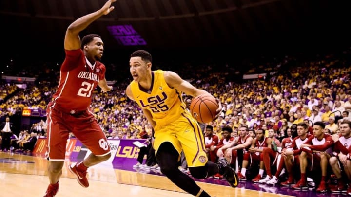 Jan 30, 2016; Baton Rouge, LA, USA; LSU Tigers forward Ben Simmons (25) drives past Oklahoma Sooners forward Dante Buford (21) during the first half of a game at the Pete Maravich Assembly Center. Mandatory Credit: Derick E. Hingle-USA TODAY Sports