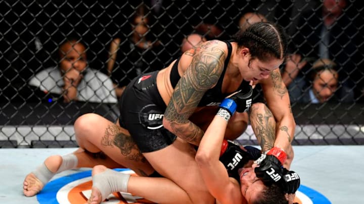 LAS VEGAS, NEVADA - DECEMBER 14: Amanda Nunes of Brazil (top) strikes Germaine de Randamie of Netherlands in their UFC women's bantamweight championship bout during the UFC 245 event at T-Mobile Arena on December 14, 2019 in Las Vegas, Nevada. (Photo by Jeff Bottari/Zuffa LLC)