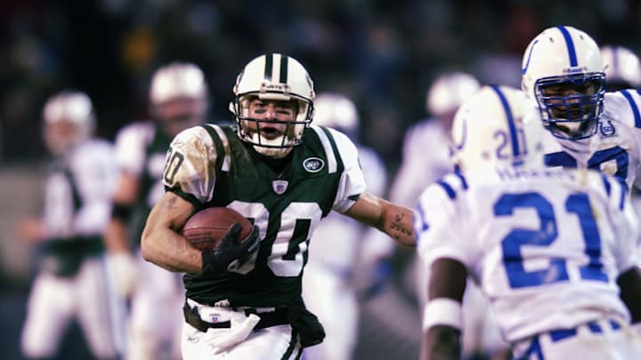 EAST RUTHERFORD, NJ – JANUARY 4: Wide receiver Wayne Chrebet #80 of the New York Jets carries the ball during the AFC Wildcard Game against the Indianapolis Colts at Giant Stadium on January 4, 2003 in East Rutherford, New Jersey. The Jets won 41-0. (Photo by Ezra Shaw/Getty Images)