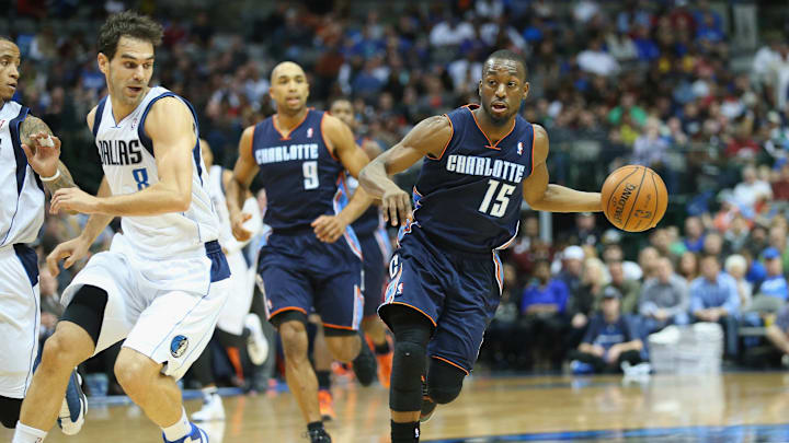 DALLAS, TX – DECEMBER 03: Kemba Walker #15 of the Charlotte Bobcats dribbles the ball past Jose Calderon #8 of the Dallas Mavericks at American Airlines Center on December 3, 2013 in Dallas, Texas. NOTE TO USER: User expressly acknowledges and agrees that, by downloading and or using this photograph, User is consenting to the terms and conditions of the Getty Images License Agreement. (Photo by Ronald Martinez/Getty Images)