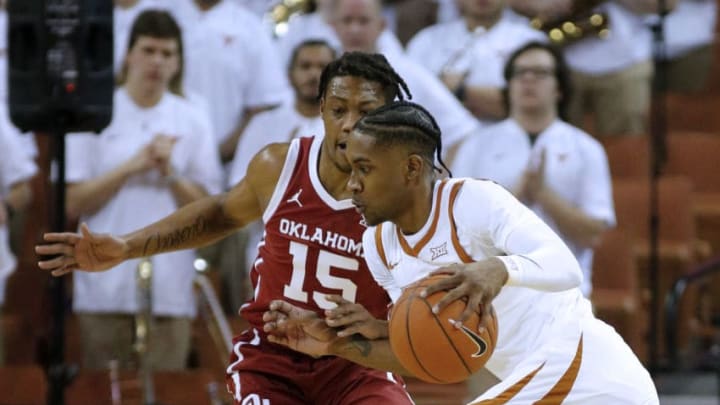 AUSTIN, TEXAS - JANUARY 08: Jase Febres #13 of the Texas Longhorns drives around Alondes Williams #15 of the Oklahoma Sooners at The Frank Erwin Center on January 08, 2020 in Austin, Texas. (Photo by Chris Covatta/Getty Images)