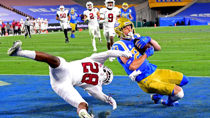 Dec 19, 2020; Pasadena, California, USA; Stanford Cardinal cornerback Salim Turner-Muhammad (28) defends UCLA Bruins wide receiver Chase Cota (23) as he is able to hang on to the ball for a touchdown in the third quarter of the game at the Rose Bowl. Mandatory Credit: Jayne Kamin-Oncea-USA TODAY Sports