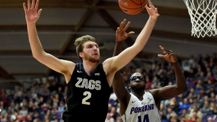 PORTLAND, OREGON - JANUARY 02: Drew Timme #2 of the Gonzaga Bulldogs goes after a rebound with Tahirou Diabate #14 of the Portland Pilots during the second half of the game at Chiles Center on January 02, 2020 in Portland, Oregon. Gonzaga won 85-72. (Photo by Steve Dykes/Getty Images)