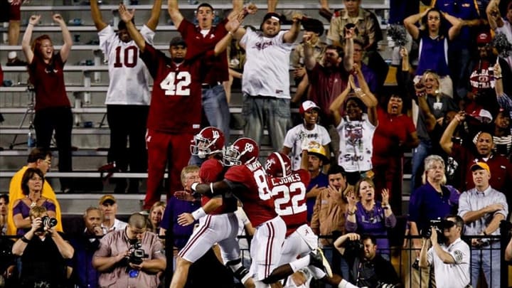 November 3, 2012; Baton Rouge, LA, USA; Alabama Crimson Tide quarterback AJ McCarron (10) celebrates with wide receiver Kevin Norwood (83) after a touchdown run during the first half against the LSU Tigers at Tiger Stadium. Alabama defeated LSU, 21-17. Mandatory Credit: Derick E. Hingle-USA TODAY Sports