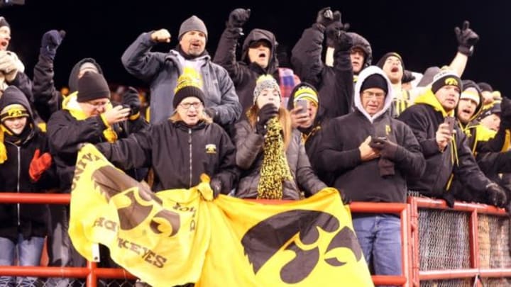 Nov 27, 2015; Lincoln, NE, USA; Iowa Hawkeyes fans celebrate after beating the Nebraska Cornhuskers at Memorial Stadium. Iowa beat Nebraska 28-20. Mandatory Credit: Reese Strickland-USA TODAY Sports