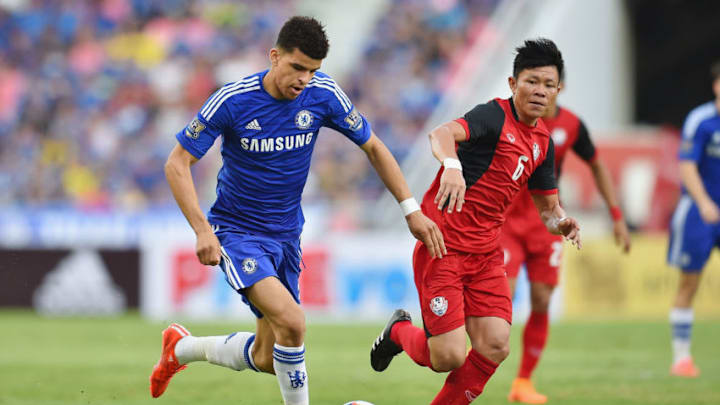 BANGKOK, THAILAND - MAY 30: Dominic Solanke #35 of Chelsea FC (L) and Yuthajak Konjan #6 of Thailand national team (R) competes for the ball during the international friendly match between Thailand All-Stars and Chelsea FC at Rajamangala Stadium on May 30, 2015 in Bangkok, Thailand. (Photo by Thananuwat Srirasant/Getty Images)