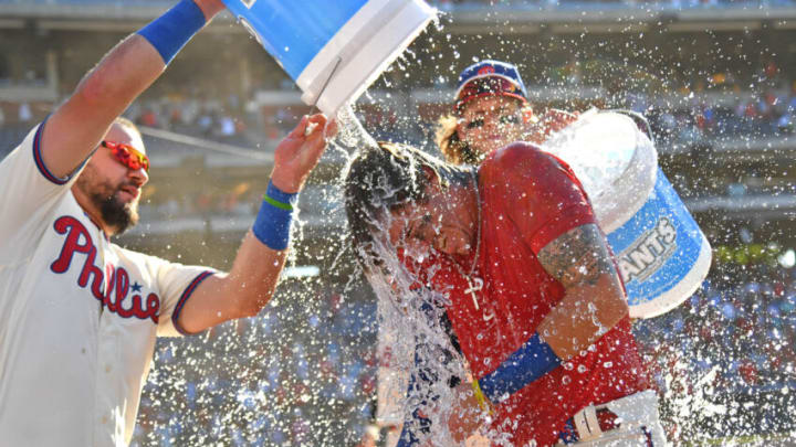 Jun 5, 2022; Philadelphia, Pennsylvania, USA; Philadelphia Phillies third baseman Bryson Stott (5) is doused with water by left fielder Kyle Schwarber (12) and third baseman Alec Bohm (28) after he hit a three-run walk-off home run against the Los Angeles Angels during the ninth inning at Citizens Bank Park. Mandatory Credit: Eric Hartline-USA TODAY Sports