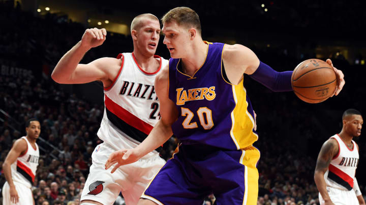 Jan 5, 2017; Portland, OR, USA; Los Angeles Lakers center Timofey Mozgov (20) drives to the basket on Portland Trail Blazers center Mason Plumlee (24) during the first quarter of the game at the Moda Center. Mandatory Credit: Steve Dykes-USA TODAY Sports