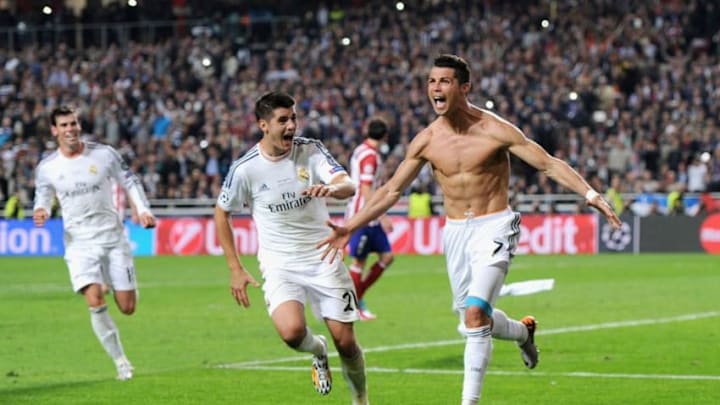 LISBON, PORTUGAL - MAY 24: Cristiano Ronaldo of Real Madrid celebrates with Alvaro Morata as he scores their fourth goal from a penalty during the UEFA Champions League Final between Real Madrid CF and Club Atletico de Madrid at Estadio da Luz on May 24, 2014 in Lisbon, Portugal. (Photo by Denis Doyle - UEFA/UEFA via Getty Images)
