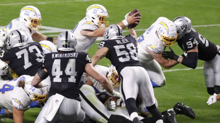 LAS VEGAS, NEVADA - DECEMBER 17: Quarterback Justin Herbert #10 of the Los Angeles Chargers dives into the end zone for a touchdown to win the game 30-27 during overtime against the Los Vegas Raiders at Allegiant Stadium on December 17, 2020 in Las Vegas, Nevada. (Photo by Christian Petersen/Getty Images)