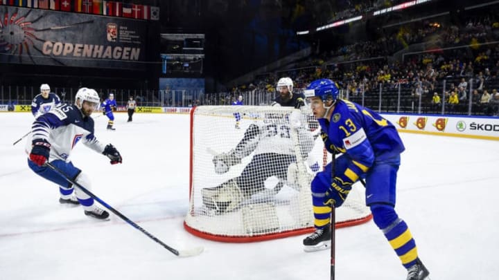 Sweden's Mattias Janmark strikes behind of France's goalie Ronan Quemener during the group A match Sweden vs France of the 2018 IIHF Ice Hockey World Championship at the Royal Arena in Copenhagen, Denmark, on May 7, 2018. (Photo by Jonathan NACKSTRAND / AFP) (Photo credit should read JONATHAN NACKSTRAND/AFP/Getty Images)