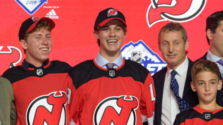 VANCOUVER, BC - JUNE 21: Jack Hughes poses for a photo onstage after being selected first overall by the New Jersey Devils during the first round of the 2019 NHL Draft at Rogers Arena on June 21, 2019 in Vancouver, British Columbia, Canada. (Photo by Derek Cain/Icon Sportswire via Getty Images)