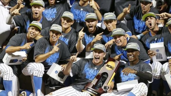 Jun 25, 2013; Omaha, NE, USA; UCLA Bruins celebrate with the championship trophy after game 2 of the College World Series finals against the Mississippi State Bulldogs at TD Ameritrade Park. UCLA defeated Mississippi State 8-0. Mandatory Credit: Derick E. Hingle-USA TODAY Sports