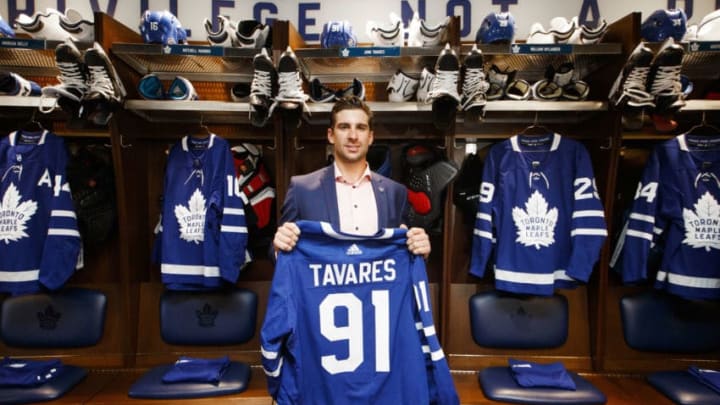 TORONTO, ON – JULY 1: John Tavares #91 of the Toronto Maple Leafs, poses with his jersey in the dressing room, after he signed with the Toronto Maple Leafs, at the Scotiabank Arena on July 1, 2018 in Toronto, Ontario, Canada. (Photo by Mark Blinch/NHLI via Getty Images)