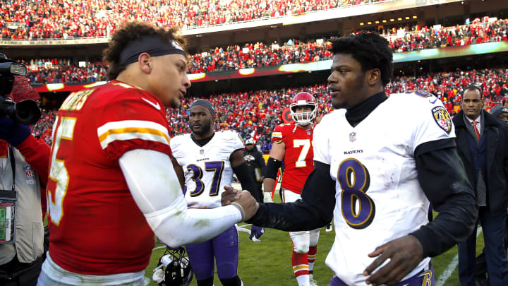 KANSAS CITY, MISSOURI – DECEMBER 09: Quarterback Patrick Mahomes #15 of the Kansas City Chiefs shakes hands with quarterback Lamar Jackson #8 of the Baltimore Ravens after the Chiefs defeated the Ravens 27-24 in overtime to win the game at Arrowhead Stadium on December 09, 2018 in Kansas City, Missouri. (Photo by Jamie Squire/Getty Images)