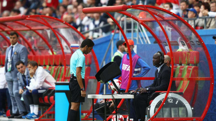 KAZAN, RUSSIA - JUNE 24: Referee Fahad Al Mirdasi reviewes the VAR footage during the FIFA Confederations Cup Russia 2017 Group A match between Mexico and Russia at Kazan Arena on June 24, 2017 in Kazan, Russia. (Photo by Ian Walton/Getty Images)