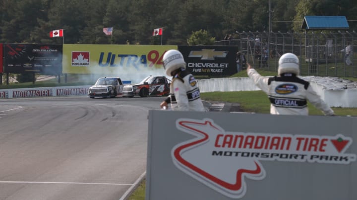 BOWMANVILLE, ON - AUGUST 26: Noah Gragson, driver of the #18 Safelite AutoGlass Toyota, takes out Todd Gilliland, driver of the #4 Frontline Toyota, on the final turn of the final lap as they both spin off the track at Canadian Tire Mosport Park on August 26, 2018 in Bowmanville, Canada. (Photo by Tom Szczerbowski/Getty Images)