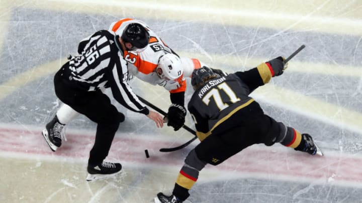 LAS VEGAS, NEVADA - JANUARY 02: William Karlsson #71 of the Vegas Golden Knights faces off with Kevin Hayes #13 of the Philadelphia Flyers during the second period at T-Mobile Arena on January 02, 2020 in Las Vegas, Nevada. (Photo by Zak Krill/NHLI via Getty Images)