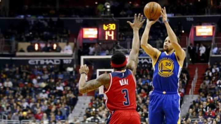 Feb 3, 2016; Washington, DC, USA; Golden State Warriors guard Stephen Curry (30) shoots the ball over Washington Wizards guard Bradley Beal (3) in the first quarter at Verizon Center. Mandatory Credit: Geoff Burke-USA TODAY Sports