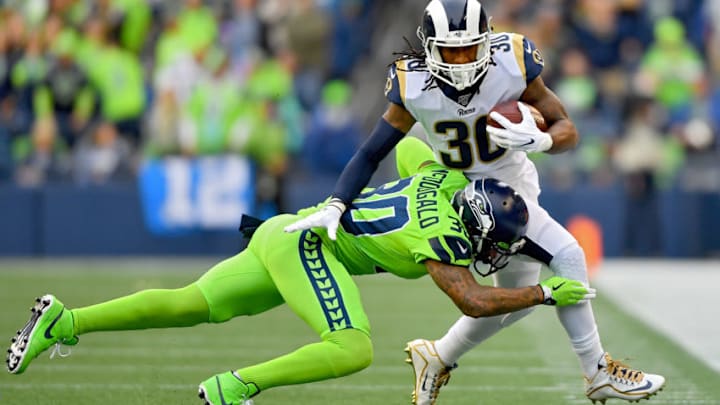 SEATTLE, WASHINGTON - OCTOBER 03: Todd Gurley #30 of the Los Angeles Rams runs the ball against Bradley McDougald #30 of the Seattle Seahawks during the first half of game at CenturyLink Field on October 03, 2019 in Seattle, Washington. (Photo by Alika Jenner/Getty Images)