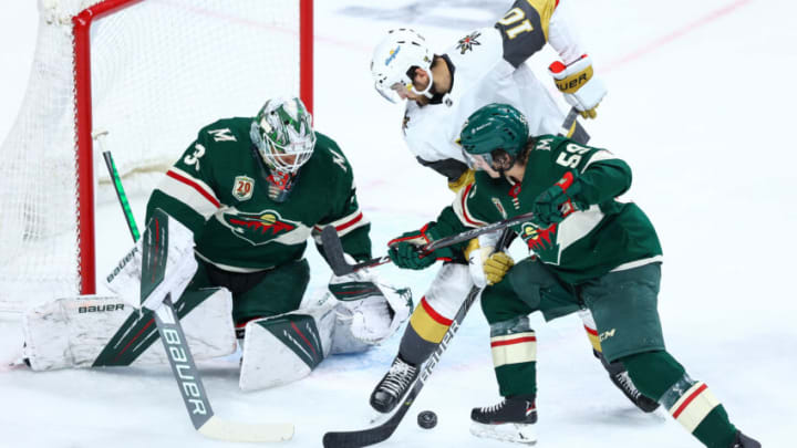Calen Addison, right, was called up to the Minnesota Wild on Sunday due to Jared Spurgeon's lower-body injury. (Photo by Harrison Barden/Getty Images)