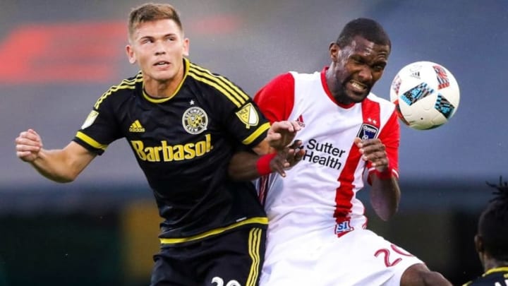 Aug 27, 2016; Columbus, OH, USA; Columbus Crew SC midfielder Will Trapp (20)goes for the ball with San Jose Earthquakes defender Shaun Francis (20) during the first half at Mapfre Stadium. Mandatory Credit: Joe Maiorana-USA TODAY Sports