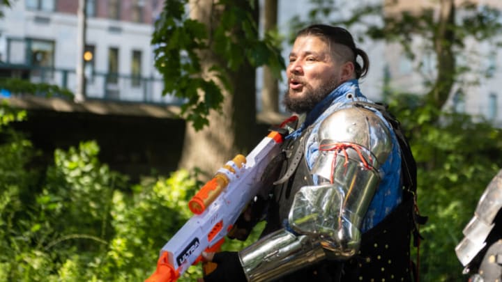 NEW YORK, NEW YORK - AUGUST 14: Gladiators NYC member Omar Meghad, dressed in medieval armor holds a Nerf in Central Park on August 14, 2021 in New York City. Once a month Gladiators NYC meet in Central Park for a full contact combat tournament. People are welcome to watch and interact with the gladiators before and after fighting. It is the oldest armored combat league in New York. (Photo by Alexi Rosenfeld/Getty Images)
