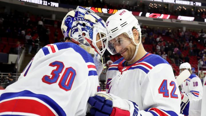RALEIGH, NC – NOVEMBER 7: Henrik Lundqvist #30 of the New York Rangers is congratulated by teammate Brendan Smith #42 after defeating the Carolina Hurricanes during an NHL game on November 7, 2019 at PNC Arena in Raleigh, North Carolina. (Photo by Gregg Forwerck/NHLI via Getty Images)