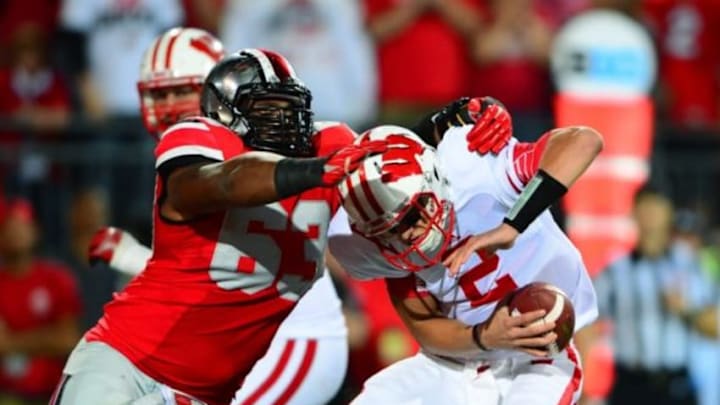 Sep 28, 2013; Columbus, OH, USA; Wisconsin Badgers quarterback Joel Stave (2) is sacked by Ohio State Buckeyes defensive lineman Michael Bennett (63) during the third quarter at Ohio Stadium. Mandatory Credit: Andrew Weber-USA TODAY Sports