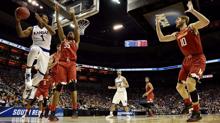 Mar 24, 2016; Louisville, KY, USA; Kansas Jayhawks guard Wayne Selden Jr. (1) passes the ball against Maryland Terrapins forward Damonte Dodd (35) during the first half in a semifinal game in the South regional of the NCAA Tournament at KFC YUM!. Mandatory Credit: Jamie Rhodes-USA TODAY Sports