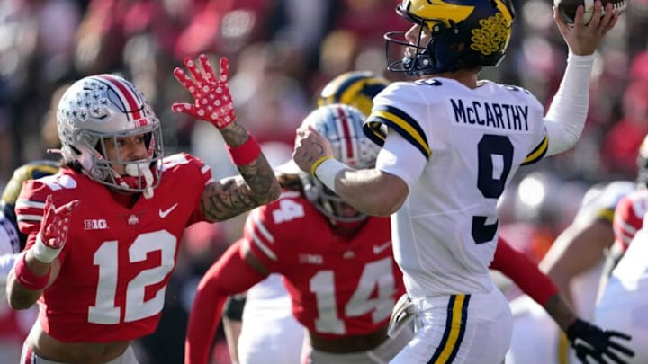 Nov 26, 2022; Columbus, OH, USA; Michigan Wolverines quarterback J.J. McCarthy (9) throws a touchdown against Ohio State Buckeyes safety Lathan Ransom (12) in the second quarter of their game at Ohio Stadium.Osu22um Kwr 33