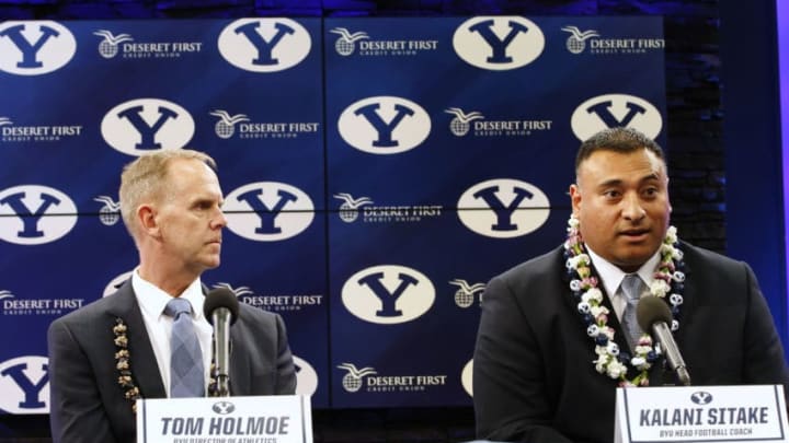 PROVO, UT - DECEMBER 21: Brigham Young University Athletic Director Tom Holme, (L) listens to BYU's new head football coach, Kalani Sitake, (R), at a press conference on December 21, 2015 in Provo, Utah. Stake who played for BYU in the 90's will become BYU's 13 head coach. (Photo by George Frey/Getty Images)