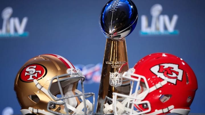 MIAMI, FLORIDA - JANUARY 29: The Vince Lombardi Trophy is displayed with helmets of the San Francisco 49ers and Kansas City Chiefs prior to a press conference with NFL Commissioner Roger Goodell for Super Bowl LIV at the Hilton Miami Downtown on January 29, 2020 in Miami, Florida. The 49ers will face the Chiefs in the 54th playing of the Super Bowl, Sunday February 2nd. (Photo by Cliff Hawkins/Getty Images)
