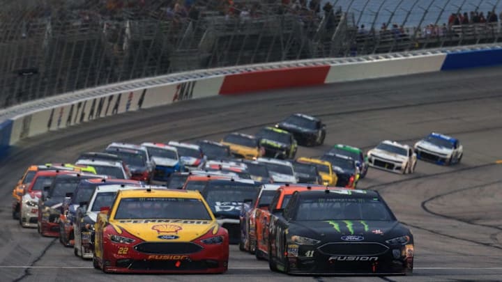 HAMPTON, GA - FEBRUARY 25: Joey Logano, driver of the #22 Shell Pennzoil Ford, and Kurt Busch, driver of the #41 Monster Energy/Haas Automation Ford, lead the field to a restart during the Monster Energy NASCAR Cup Series Folds of Honor QuikTrip 500 at Atlanta Motor Speedway on February 25, 2018 in Hampton, Georgia. (Photo by Daniel Shirey/Getty Images)