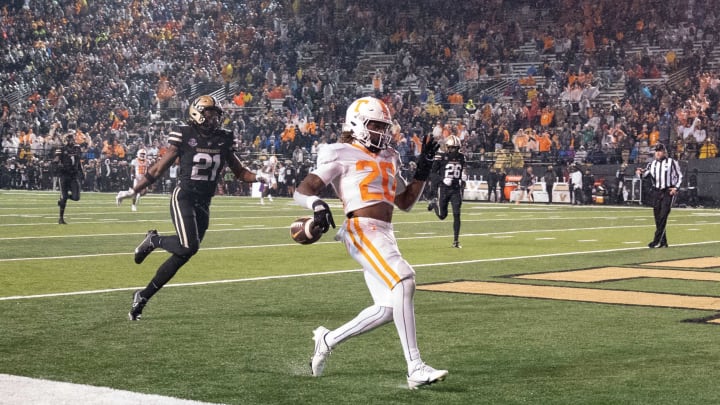Tennessee running back Jaylen Wright (20) races into the end zone for a touchdown past Vanderbilt safety Maxwell Worship (21) during the third quarter at FirstBank Stadium Saturday, Nov. 26, 2022, in Nashville, Tenn.Ncaa Football Tennessee Volunteers At Vanderbilt Commodores