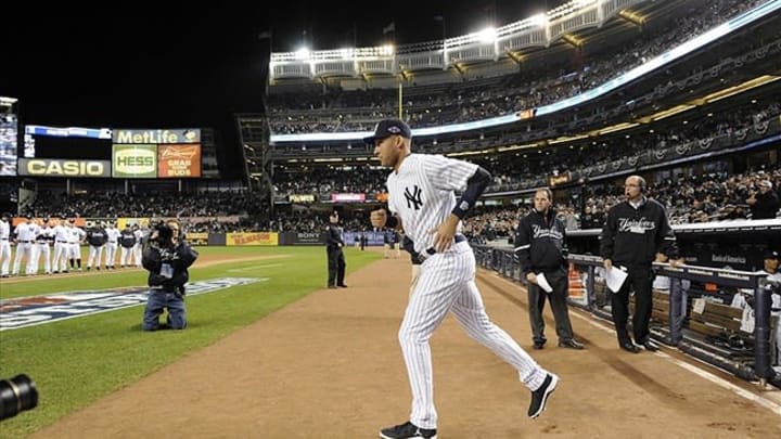 Oct 13, 2012; Bronx, NY, USA; New York Yankees shortstop Derek Jeter runs out to the field as he is introduced before game one of the 2012 ALCS against the Detroit Tigers at Yankee Stadium. Mandatory Credit: Robert Deutsch-USA TODAY Sports